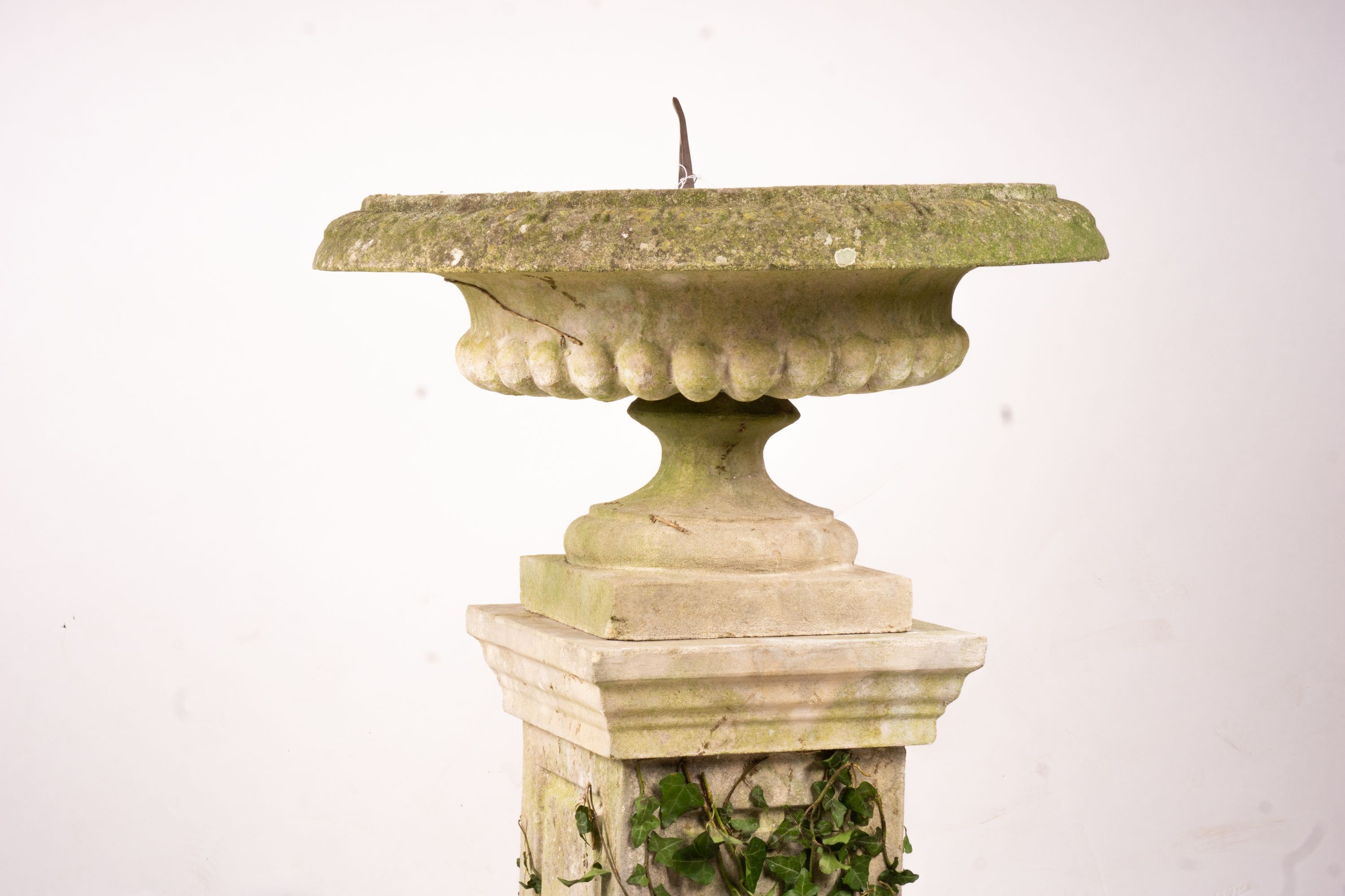 A reconstituted stone garden bird bath combined sundial on square pedestal base, height 108cm